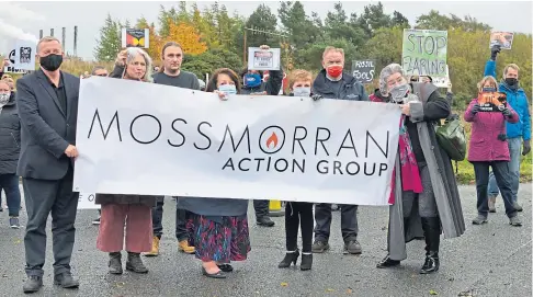  ??  ?? SIGN LANGUAGE: From left: Alex Rowley, Linda Holt, James Glen, Linda Erskine, Judy Hamilton, Alex Campbell and Mary Lockhart with demonstrat­ors holding placards. Below: The petrochemi­cals plant at Mossmorran.