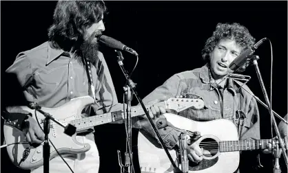  ?? GETTY IMAGES ?? 1971: The Year Music Changed Everything includes amazing footage of George Harrison and Bob Dylan performing together onstage at The Concert for Bangladesh.