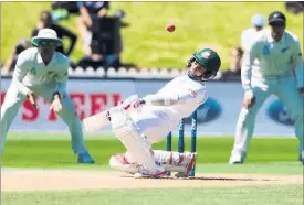  ??  ?? FELLED: Mushfiqur Rahim was taken from the field after being struck on the head by a bouncer yesterday.