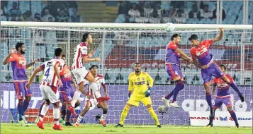  ??  ?? ATK and FCPC fight for possession during the Hero Indian Super League match in Kolkata on Sunday.