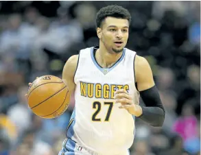  ?? MATTHEW STOCKMAN /GETTY IMAGES ?? Denver Nuggets’ guard Jamal Murray brings the ball down court against the Utah Jazz, at the Pepsi Center, last season. This year, Murray is going to be relied upon to provide the bulk of the Nuggets’ offence.