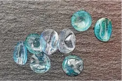  ??  ?? Dozens of used contact lenses resembling fish scales were found on a window sill by one new homeowner.