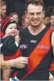  ??  ?? Brendon Goddard with his daughter before the match