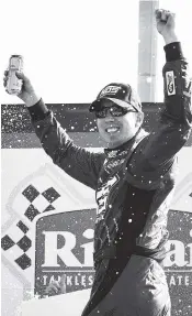  ?? ASSOCIATED PRESS PHOTOS ?? Kyle Busch celebrates in victory lane after the NASCAR Xfinity Series’ Rinnai 250 Saturday at Atlanta Motor Speedway. He won the race for the second straight year.