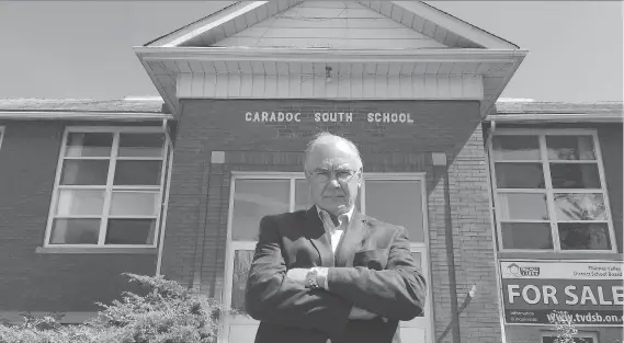  ?? DEREK RUTTAN ?? Doug Reycraft, a former mayor of Southwest Middlesex, seen standing in front of the defunct Caradoc South School in Melbourne, Ont., is the chair of Community Schools Alliance.