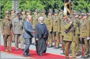  ?? REUTERS ?? Iraq's President Barham Salih (left) walks with Iranian President Hassan Rouhani during a welcome ceremony in Baghdad.