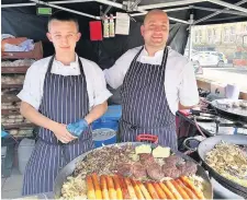  ??  ?? Some of the tempting dishes on offer at the food festival stalls