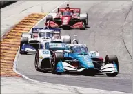  ?? Morry Gash / Associated Press ?? Josef Newgarden makes his way around Road America during the Sonsio Grand Prix Sunday in Elkhart Lake, Wis.