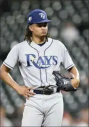  ?? GAIL BURTON — THE ASSOCIATED PRESS ?? Tampa Bay Rays pitcher Chris Archer reacts after giving up a base hit against the Baltimore Orioles during a game last week. Archer, a two-time All-Star, was traded to the Pittsburgh Pirates before the MLB trade deadline on Tuesday.