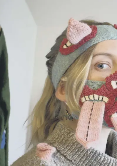  ??  ?? 0 Fashion designer Yr Johannsdot­tir wears one of her masks at her studio in Reykjavik, Iceland. The masks aim to encourage social distancing