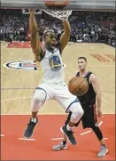  ?? AP photo ?? Andre Iguodala of the Warriors dunks as the Clippers’ Danilo Gallinari watches during the second half Thursday.