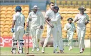  ??  ?? Kedar Jadhav (left) held Rest of India’s innings together before falling to Abhimanyu Mithun (centre) on Day 2 of Irani Cup. PTI PHOTO