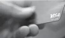  ?? Jenny Kane /Associated Press ?? A trade associatio­n says it is concerned about “excessivel­y high” fees charged to retailers by Visa and Mastercard.