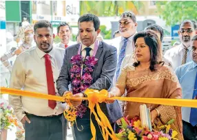  ?? ?? L-R: Mr Sachintha Thalagahaw­aththa – AGM Galle Branch, Mr Nalin Herath - Chairman of Home Lands Group and Mrs Harshani Herath – Director of Home Lands Group inaugurate the newly relocated Galle Branch.