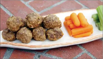  ?? The Associated Press ?? Baked Buffalo-style meatballs in Coronado, Calif. This dish is from a recipe by Melissa d'Arabian.