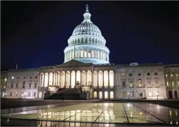  ?? OLGA MALTSEVA/AFP ?? The US Capitol at night after the Senate adjourned in Washington, DC, on Saturday. The federal government is shut down after the Senate failed to pass a resolution to temporaril­y fund the government through February 16.