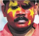  ??  ?? STRUGGLE. Supporters of Sri Lanka’s Marxist JVP participat­e in a Labour Day demonstrat­ion in Colombo yesterday.