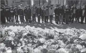  ?? CP FILE PHOTO ?? Flowers line a memorial at Mel Lastman Square in Toronto on April 26 for the victims of a deadly van attack.