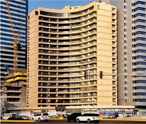  ?? Abu Dhabi Department of Culture and Tourism ?? Above, Harib tower on Sultan bin Zayed the First Street; left, the Niqba bin Ateej water tank