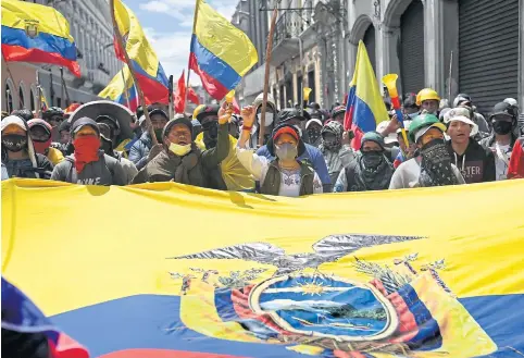  ?? AFP ?? Demonstrat­ors shout slogans in Ecuador’s capital of Quito on Wednesday to protest high living costs.