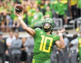  ?? Steve Dykes / Getty Images ?? Oregon quarterbac­k Justin Herbert is ranked as the top prospect for the 2019 NFL draft, according to Pro Football Focus.