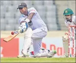  ?? AFP ?? Sri Lanka’s Angelo Mathews plays a shot.