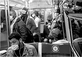  ?? MICHEL EULER/AP ?? People ride a subway train Monday in Paris. The French left their homes for the first time in two months without permission slips as the country cautiously lifted its lockdown.