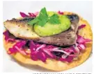  ?? JOE BURBANK/ORLANDO SENTINEL ?? Pacifico true striped bass tostada is offered at the Coastal Eats marketplac­e.