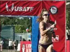  ?? PHOTO BY KEVIN J. CUNNINGHAM ?? Robyn Stevens walks through the Olympic Team Start/Finish banner at the Olympic Trials.