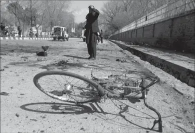  ??  ?? An Afghan man inspects the site of the suicide attack. (Photo: Reuters UK)