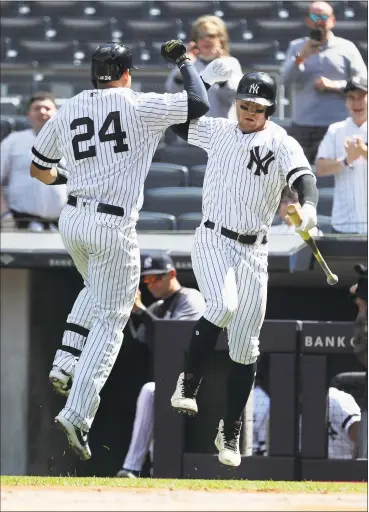  ?? Al Bello / Getty Images ?? The Yankees’ Gary Sanchez (24) celebrates with Clint Frazier after Sanchez’s first-inning home run against the Orioles at Yankee Stadium on Wednesday.