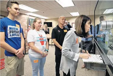  ?? AMY BETH BENNETT/SUN SENTINEL ?? Ban Assault Weapons Now Chairwoman Gail Schwartz submits 200 petitions to the Broward County Supervisor of Elections.