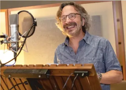  ?? DREAMWORKS PHOTOS ?? ABOVE: Marc Maron voices Snake at a recording session. LEFT: Mr. Snake (Marc Maron) and Mr. Wolf (Sam Rockwell) in a scene from “The Bad Guys.”