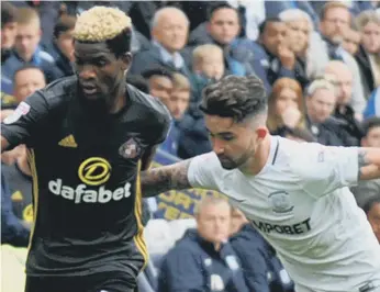  ??  ?? Didier Ndong (left) gets stuck in for Sunderland at Preston two weeks ago.