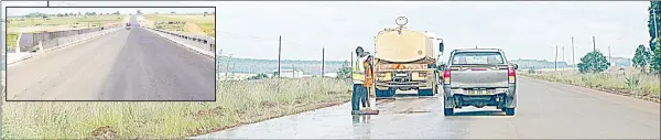  ?? (Pics: Sifiso Dlamini) ?? Constructi­on workers preparing a section of the road near Gege for road marking. (INSET) The Mkhondvo River Bridge at Jabulani is now fully operationa­l.