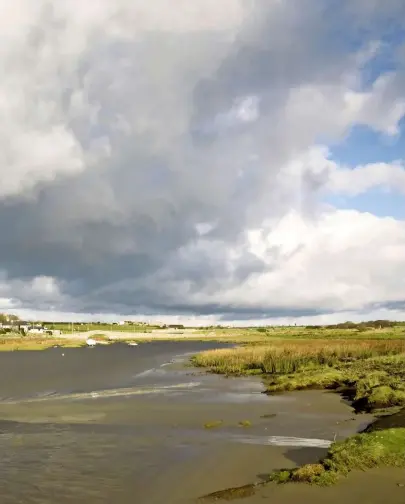  ??  ?? Under heavy February skies, Aberffraw’s pastel cottages hug the banks of the tidal Afon Ffraw, or River Ffraw, from which the town takes its name.