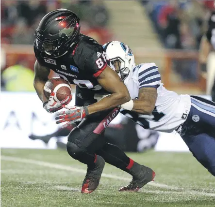  ?? LEAH HENNEL ?? Kamar Jorden and the Calgary Stampeders pulled away from Marcus Alford and the Toronto Argos in the second half Friday at McMahon Stadium, scoring the final 14 points to improve their record to 15-1-1 on the season.