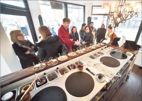  ?? Peter Hvizdak / Hearst Connecticu­t Media file photo ?? Visitors sample food at Crepes Choupette, a kiosk-like eatery in the Broadway Shopping District in New Haven in 2018. Plans are before the Darien Planning and Zoning Commission for Crepes Choupette opening a location in downtown Darien.