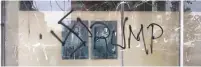  ?? (Facebook) ?? SPRAY-PAINTED GRAFFITI shows the ‘T’ in ‘Trump’ replaced by a swastika on a South Philadelph­ia storefront window on Wednesday.