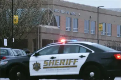  ?? AP Photo/Susan Walsh ?? Shooting: Deputies, federal agents and rescue personnel, converge on Great Mills High School, the scene of a shooting, Tuesday morning, in Great Mills, Maryland