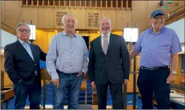  ??  ?? Michael Franks, Michael Nelkin, Rabbi Geoffrey Hyman and Rodney Stone inside the Southend and Westcliff Hebrew Congregati­on shul building, a feature of which is the stained glass windows