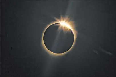  ?? Esteban Felix The Associated Press ?? The moon blocks the sun Tuesday during a total solar eclipse in La Higuera, a part of northern Chile known for clear skies.