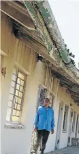  ??  ?? STATE OF DISREPAIR: Frank Jenniker, 69, checks out the roofing at the Elizabeth Stuurman old age home