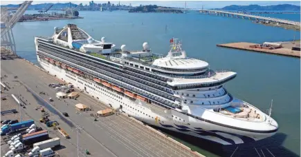  ?? NOAH BERGER / AP ?? Tents stand on a wharf Monday near the Grand Princess at the Port of Oakland in Oakland, Calif. The cruise ship maintained a holding pattern off the coast for days, carrying multiple people who tested positive for COVID-19.