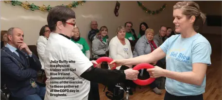  ??  ?? Julie Duffy who is a physical trainer with Siel Blue Ireland demonstrat­ing some of the exercise to those gathered at the COPD day in Drogheda.