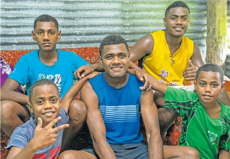  ?? Photo: Leon Lord ?? Siblings (front left) Petero Muavesi, Suliano Komai (back left), Iowane Savenaca (middle), Lorosio Civoniceva (back right) Samuela Kava (front right) are proud of their brother at their home in Nadera on the 16th January 2021.