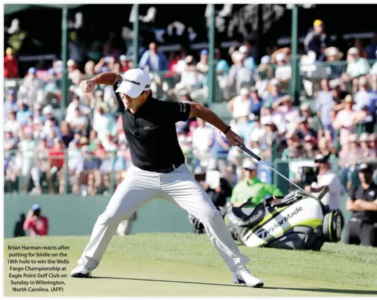  ??  ?? Brian Harman reacts after putting for birdie on the 18th hole to win the Wells Fargo Championsh­ip at Eagle Point Golf Club on Sunday in Wilmington, North Carolina. (AFP)