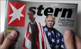  ?? MICHAEL SOHN, THE ASSOCIATED PRESS ?? A copy of the ’Stern’ news magazine in Berlin showing U.S. President Donald Trump draped in the American flag while giving a stiff-armed Nazi salute.