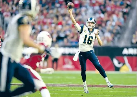  ?? Wally Skalij Los Angeles Times ?? QUARTERBAC­K Jared Goff delivers on the move to receiver Cooper Kupp on Sunday. Goff threw for 424 yards and two scores — his first touchdown passes since Oct. 27 — as the Rams bounced back from a blowout loss to Baltimore and improved to 7-5 on the season.