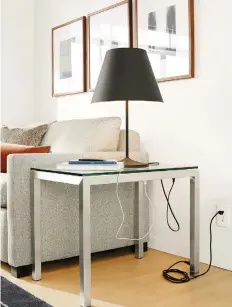  ??  ?? PHOTOS: ROOM &amp; BOARDFor the multitaske­rs looking for some extra juice: The Portica end table from Room &amp; Board has plugs built in and comes both standard and in a C-shaped version, which is good for tight spaces.